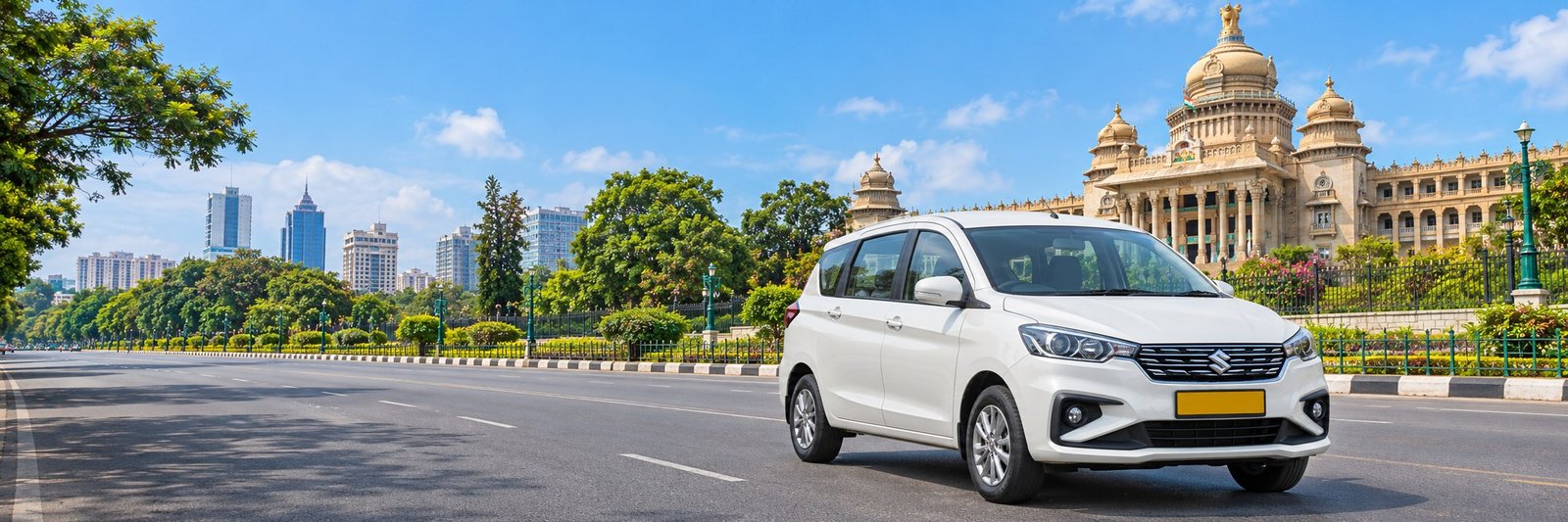 White local taxi outside Bangalore's Vidhana Soudha on a sunny city road