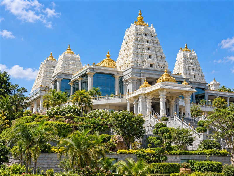White and gold temple towers at ISKCON Bangalore