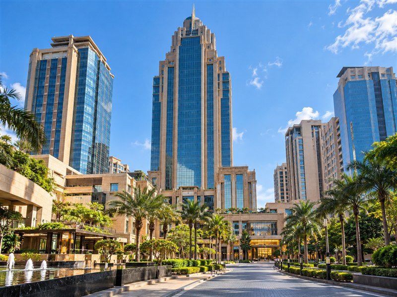 UB City's modern towers and Bangalore city streets